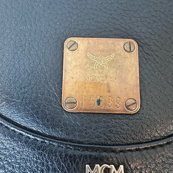 MCM Black Leather Drawstring Shoulder Backpack with Gold Accents - Picture 3 of 11